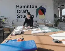  ?? ?? Dayna Gedney works on her current project on a cutting table in the textiles area at Hamilton Craft Studios.