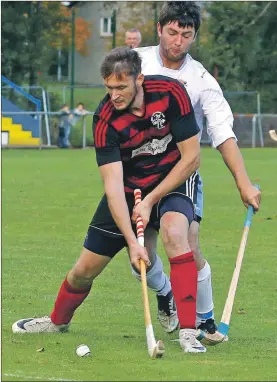  ??  ?? Willie Neilson opens the scoring for Oban Camanachd against Skye.