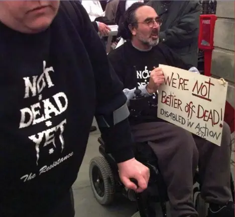  ??  ?? Protesters join a 1999 rally against philosophe­r Peter Singer. To many people with disabiliti­es, Singer’s views are dangerous, but demands thathe be silenced have also spurred a backlash from defenders of academic freedom.