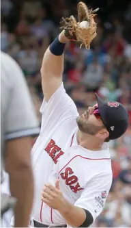  ?? (Photo by Steven Senne, AP) ?? Boston Red Sox's and former Mississipp­i State player Mitch Moreland catches a fly ball in the fourth inning of Sunday's game against the New York Yankees in Boston.