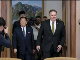  ??  ?? U.S. Secretary of State Mike Pompeo (right) and Kim Yong Chol (left) a North Korean senior ruling party official and former intelligen­ce chief, return to discussion­s after a break at Park Hwa Guest House in Pyongyang, North Korea, on Saturday. AP...