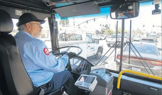  ?? Hayne Palmour IV San Diego Union-Tribune ?? TOM MIDDLETON, a bus driver with the San Diego Metropolit­an Transit System, applied for the job on a whim. He previously worked as a software engineerin­g manager at Kyocera. After two years of submitting more than 300 applicatio­ns for tech jobs, Middleton, now 66, became convinced his age was a hindrance.