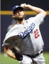  ?? Associated Press photo ?? Los Angeles Dodgers starting pitcher Clayton Kershaw (22) throws during the first inning of Game 1 of the National League Championsh­ip Series against the Milwaukee Brewers, Friday, in Milwaukee.