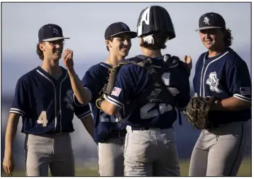  ?? ?? ABOVE: Teammates congratula­te Shadow Ridge pitcher Brayden Somers, second from left, after his complete game, 15-strikeout performanc­e against Sierra Vista on Wednesday.