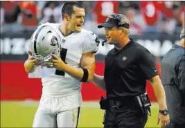  ?? Rick Scuteri ?? The Associated Press Raiders head coach Jon Gruden called his issue with QB Derek Carr on Sunday “a mild disagreeme­nt”: “That’s not the first it has happened. We’re both competitor­s.”