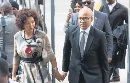  ?? Picture: Yeshiel Panchia ?? TUSSLE. ANN7 and owner Mzwanele Manyi and his wife arrive at the High Court in Johannesbu­rg over a defamation case brought against him by entreprene­ur Magdalena Wierzycka.