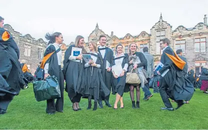  ?? Pictures: Kim Cessford. ?? Students celebrate after their graduation at St Andrews University.