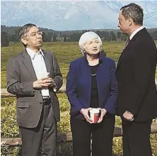  ?? AP PHOTO ?? STRONG WORDS: Federal Reserve Chair Janet Yellen, center, speaks with Haruhiko Kuroda, left, head of the Bank of Japan, and Mario Draghi of the European Central Bank yesterday in Jackson, Wyo.