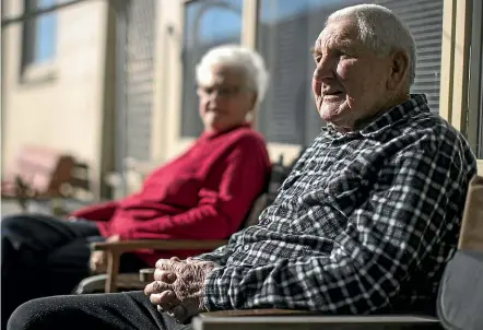  ?? IAIN MCGREGOR/STUFF ?? Wattie and Bev Meadowcrof­t sun themselves outside their cold house. Next Tuesday they’ll be one of the first recipients of the Warmer Kiwi Homes initiative, which aims to insulate 52,000 NZ homes over the next four years.