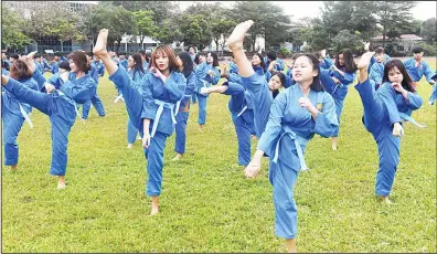  ??  ?? In this picture taken on Dec 20, 2017 students from the Research Institute for Vovinam and Sport Developmen­t (IVS), a boarding school set
up to treat online addictions and discipline unruly youngsters aged from 13 to 19, practise vovinam at the campus...