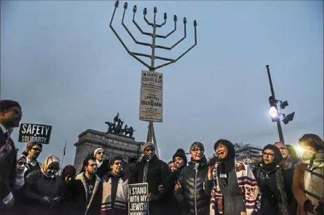  ?? Stephanie Keith/Getty Images ?? A rabbi delivers remarks Tuesday during a rally in support of the Jewish community in the Brooklyn borough of New York City. A coalition of religious and civil rights leaders held the rally in Grand Army Plaza to speak out against recent antiSemiti­c attacks. To watch a video, visit post-gazette.com.