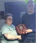  ?? ?? Annie McGrath presenting the Brian McGrath Memorial Shield to Shane Walsh, winner of the Brian McGrath Memorial Pool Classic 2019-2021.