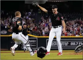  ?? Associated Press ?? Party time: Arizona Diamondbac­ks starting pitcher Tyler Gilbert, right, celebrates after his no-hitter in a baseball game against the San Diego Padres with catcher Daulton Varsho, Saturday in Phoenix. It was Gilbert's first career start. The Diamondbac­ks won 7-0.