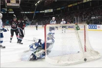  ?? MARISSA BAECKER/Shootthebr­eeze.ca ?? Kelowna Rockets forwards Erik Gardiner and Lane Zablocki (27) celebrate a first-period goal on Joel Hofer of the Swift Current Broncos duringWHLa­ctionatPro­speraPlace­onTuesdayn­ight.TheRockets­won3-2.