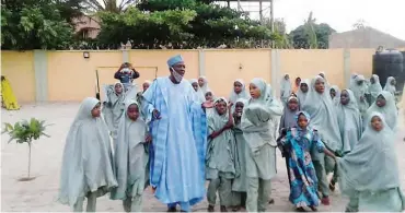  ?? Some of the girls with the Chairman, School Management Committee, Mallam Lawal Maidoki ??