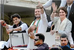  ?? PTI ?? Congress president Rahul Gandhi with party general secretarie­s Priyanka Gandhi Vadra and Jyotiradit­ya Scindia during a roadshow in Lucknow on Monday. —