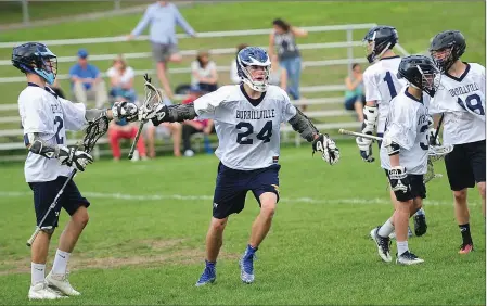  ?? Photos by Ernest A. Brown ?? With a number of key attacks out for the season with injuries, junior attack Avery Tupper (24) scored a hat trick in Friday afternoon’s 6-5 Division II defeat to Westerly. Freshman middie Nick Hammond (18, below) chipped in with a goal and a pair of...