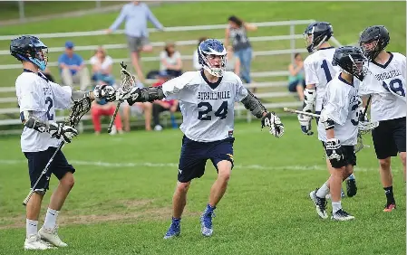  ?? Photos by Ernest A. Brown ?? With a number of key attacks out for the season with injuries, junior attack Avery Tupper (24) scored a hat trick in Friday afternoon’s 6-5 Division II defeat to Westerly. Freshman middie Nick Hammond (18, below) chipped in with a goal and a pair of...