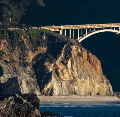  ??  ?? Big Sur’s iconic Bixby Creek Bridge catches the late afternoon sunlight along the dramatic California coast.