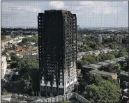  ?? AP/KIRSTY WIGGLESWOR­TH ?? The charred remains of Grenfell Tower are seen Saturday.