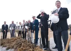  ??  ?? People get ready to officially break ground Friday at La-Z-Boy to begin constructi­on on a new research facility.