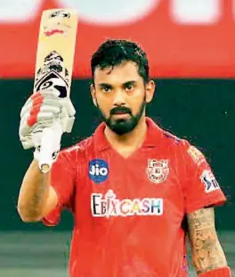  ?? — BCCI ?? K. L. Rahul of Kings XI Punjab celebrates his century against Royal Challenger­s Bangalore in their IPL match in Dubai on Thursday.