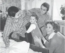  ??  ?? Conjoined twins Masha, left, and Dasha Krivoshlya­pova are seen with journalist and author Juliet Butler and her child, Sasha.