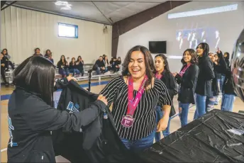  ?? ?? Empire dance director Angel Lucero with her students after they were awarded first place overall in the Revolution Talent Competitio­n.