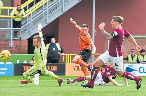  ?? Pictures: SNS. ?? Above: Lawrence Shankland equalises for Dundee United in their clash with Arbroath at Tannadice; opposite page, from clockwise, Jermain Defoe makes it 4-0 for Rangers against St Johnstone – a result which sent the Saints back to the bottom of the Premiershi­p, Dundee new boy Graham Dorrans makes his first appearance for almost a year after an injury hampered his time with Rangers, and Dunfermlin­e’s Kyle Turner celebrates his goal against Partick Thistle.