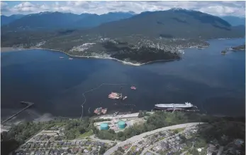  ?? CP FILE PHOTO ?? A aerial view of Kinder Morgan’s Trans Mountain marine terminal, in Burnaby is shown last year. The National Energy Board will hear oral traditiona­l evidence from Indigenous groups in the coming weeks as part of its new review of the Trans Mountain pipeline expansion.