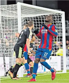  ??  ?? Opportunit­y lost: Christian Benteke shows his disappoint­ment at missing a penalty