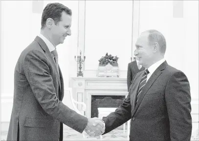  ?? ALEXEI DRUZHININ/ASSOCIATED PRESS ?? Russian President Vladimir Putin (right) and Syrian President Bashar Assad met Tuesday in Moscow. It was Assad’s first known trip abroad since the war broke out in Syria in 2011. The two stressed that the military operations in Syria must lead to a...