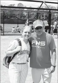  ?? MARK HUMPHREY ENTERPRISE-LEADER ?? Farmington 2018 graduate Camryn Journagan, shown with head coach Randy Osnes, played softball in the spring of her senior year in the last of three sports she lettered in. This photo was taken on May 19 after the 5A State finals played at the Benton Sports Complex. A three-sport letter-winner as a senior, Journagan has been named Female Athlete of the Year for school year 2017-2018 at Farmington by the Enterprise-Leader.