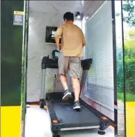  ?? LIU HONGSHENG / FOR CHINA DAILY ?? A man exercises in a mini-gym in Beijing on Thursday.