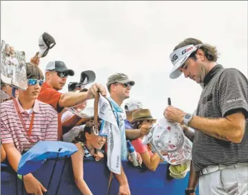  ?? By Derick E. Hingle, US Presswire ?? In demand: Bubba Watson signs autographs April 29 after the Zurich Classic of New Orleans, the only tournament he has played since winning the Masters.