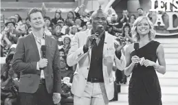  ??  ?? Jonathan Magnum, Wayne Brady and Tiffany Coyne in “Let’s Make a Deal”