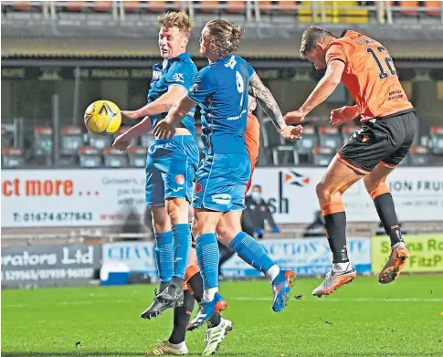  ??  ?? Ryan Edwards gets in a header at goal with Nicky Clark applying the finishing touch to put Dundee United ahead.