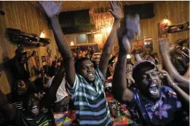  ?? Picture: Alaister Russell ?? South Africans celebrate at Xai Xai in Melville after the Springboks beat New Zealand 12-11 in the Rugby World Cup final.