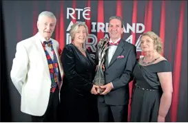  ?? (Pic: Eric Molloy) ?? Director of Ballyduff Drama Group, Ger Canning (second left) accepting the All-Ireland Drama trophy from Tom McGuire (former Head of RTÉ Radio 1) in the presence of adjudicato­r Michael Poynor and Regina Bushell, festival director.