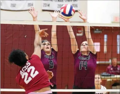  ?? PETE BANNAN — DIGITAL FIRST MEDIA ?? Garnet Valley’s Gabby Davis (9) and Julianne Hurley (14) go to block a shot from Lower Merion’s Artie Felder during the Jaguars’ 3-0 victory over the Aces Monday at Garnet Valley.