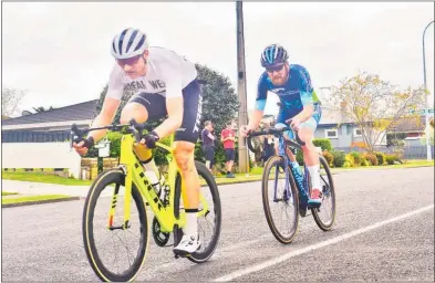  ??  ?? Te Awamutu Sports Cycling’s Hamish Bond leads club-mate Alex Heaney over the line for the start of the fifth and final lap of Sunday’s Te Awamutu Sports Club Open.
