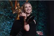  ??  ?? Kate Winslet, winner of the award for outstandin­g lead actress in a limited or anthology series or movie for “Mare of Easttown” poses at the 73rd Primetime Emmy Awards at L.A. Live in Los Angeles.