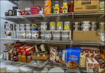  ?? L.E. Baskow Las Vegas Review-Journal @Left_Eye_Images ?? Some of the many food items stored in the home pantry of Cory and Holly Steed.