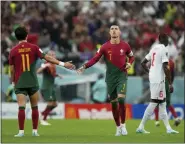  ?? ALESSANDRA TARANTINO — THE ASSOCIATED PRESS ?? Portugal’s Cristiano Ronaldo, right, runs during the World Cup round of 16soccer match between Portugal and Switzerlan­d, at the Lusail Stadium in Lusail, Qatar, Tuesday.