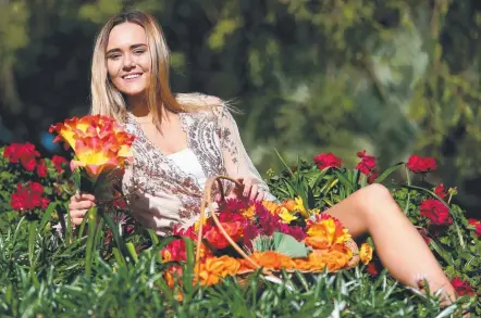  ?? Picture: MIKE BATTERHAM ?? Australian Supermodel of the Year entrant Stacey Beachley from Helensvale among spring blooms.