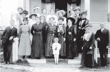  ??  ?? In this photo from 1916, Nellie McClung, who campaigned for women’s rights and eventually moved to Saanich, stands behind her son Mark on the steps of her Edmonton home. To McClung’s left is English suffragist leader Emmeline Pankhurst, and to...