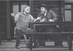  ?? ?? Yehezkel Lazarov (Tevye), left, and Andrew Hendrick (Lazar) in the North American tour of “Fiddler on the Roof.”