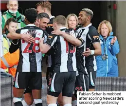  ?? ?? Fabian Schar is mobbed after scoring Newcastle’s second goal yesterday