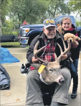  ?? SUBMITTED PHOTO ?? Doggone that was a good day hunting! Dick Adlen of Clinton Township and his 12-year-old granddaugh­ter, Autumn Pratt, present a photograph­ic memory. And there’s another just like it; Adlen got two bucks with one hour while bow hunting in northern Macomb County.