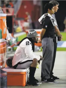  ?? Rick Scuteri / Associated Press ?? Marshawn Lynch sits during the national anthem before the Raiders’ preseason opener in Arizona.